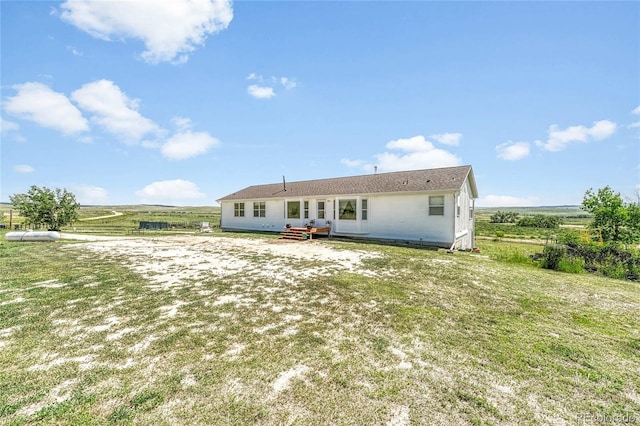 21494 Way Of Peace, Deer Trail, CO 80105 - back of property with a lawn and a view of rural / pastoral area
