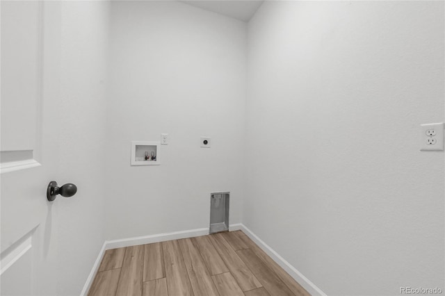 clothes washing area featuring washer hookup, hookup for an electric dryer, laundry area, and light wood-style flooring