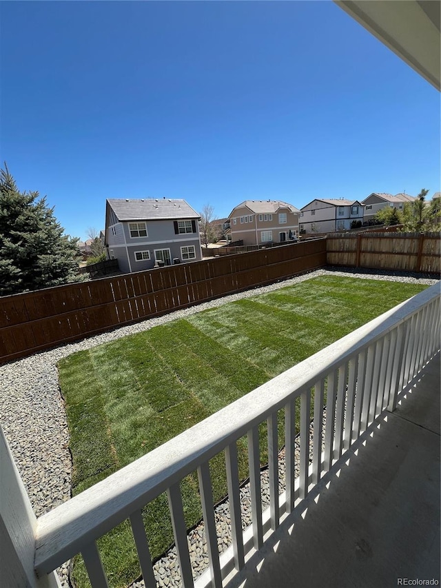 view of yard featuring a residential view and a fenced backyard