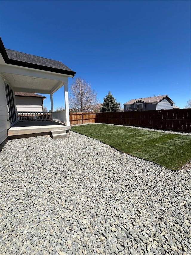 view of yard with a patio and a fenced backyard