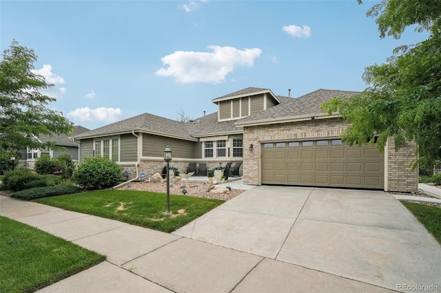 7548 S Biloxi Way, Aurora, CO 80016 - prairie-style home featuring brick siding, a garage, concrete driveway, roof with shingles, and a front lawn