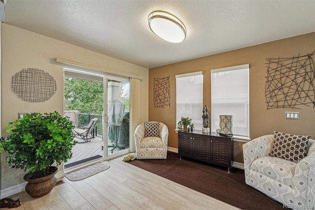 7548 S Biloxi Way, Aurora, CO 80016 - sitting room with dark wood-type flooring and baseboards