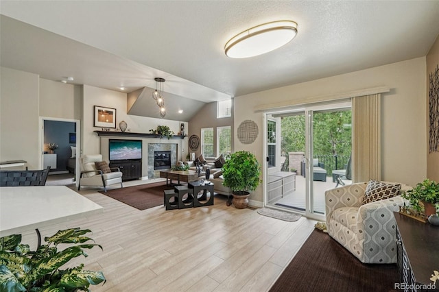 7548 S Biloxi Way, Aurora, CO 80016 - living area with light wood-type flooring and vaulted ceiling