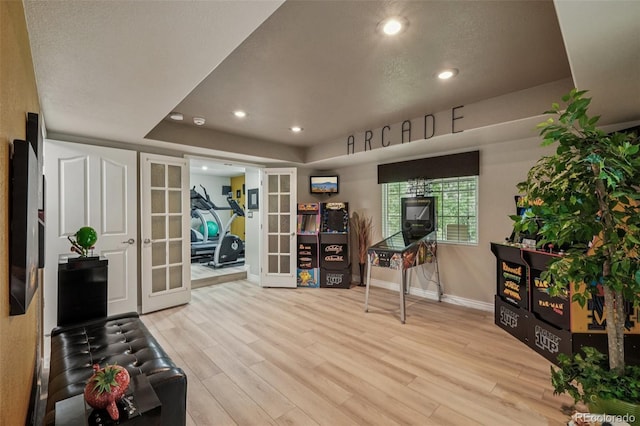 7548 S Biloxi Way, Aurora, CO 80016 - exercise area with french doors, wood finished floors, recessed lighting, and a tray ceiling