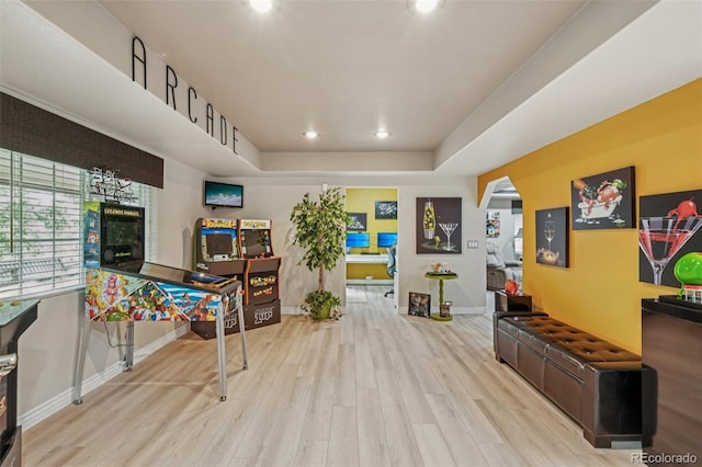 7548 S Biloxi Way, Aurora, CO 80016 - rec room with wood finished floors, recessed lighting, a tray ceiling, and healthy amount of natural light