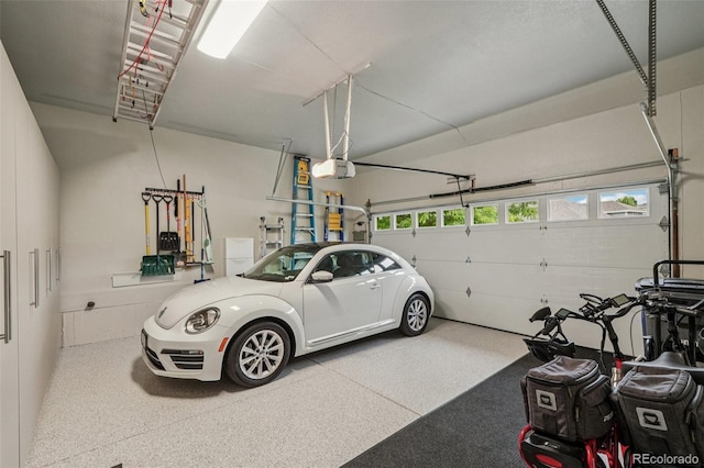 7548 S Biloxi Way, Aurora, CO 80016 - garage featuring a garage door opener