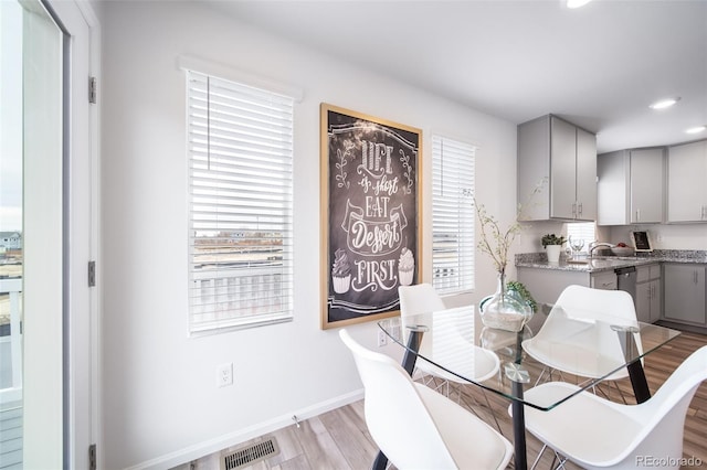 dining room with light hardwood / wood-style floors