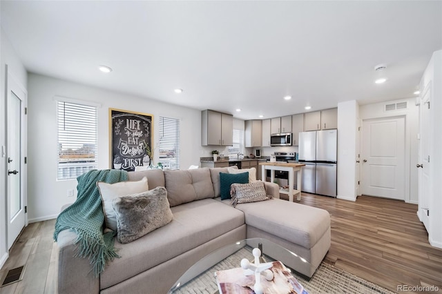 living room with light hardwood / wood-style flooring