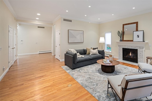 living room with a baseboard heating unit, crown molding, light wood-style flooring, recessed lighting, and a fireplace with flush hearth
