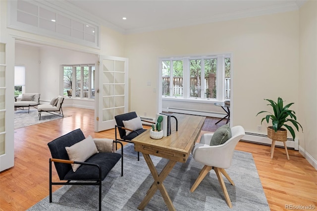 home office featuring a baseboard radiator, ornamental molding, healthy amount of natural light, light wood-style flooring, and recessed lighting