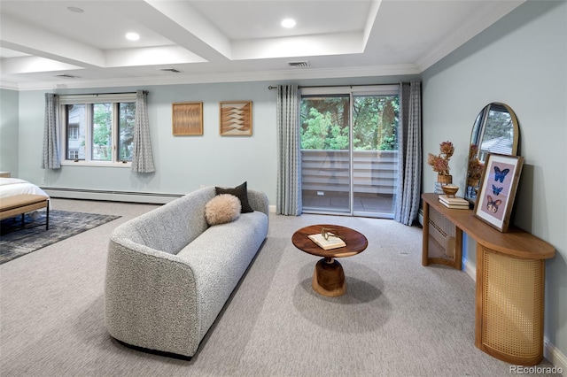 living area with baseboard heating, a tray ceiling, carpet floors, plenty of natural light, and ornamental molding