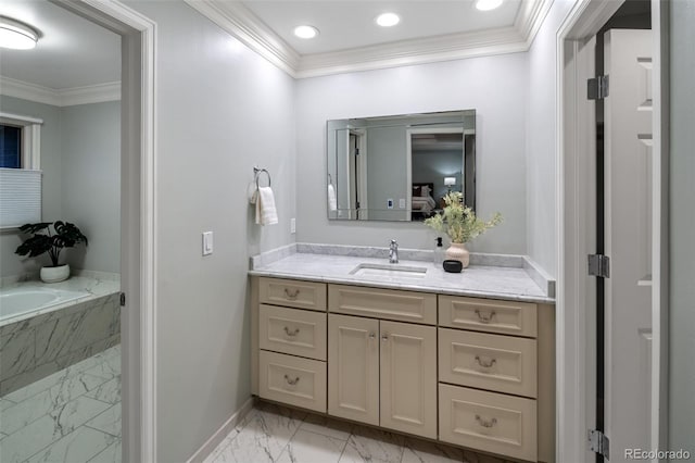full bath with marble look tile flooring, baseboards, crown molding, vanity, and a garden tub