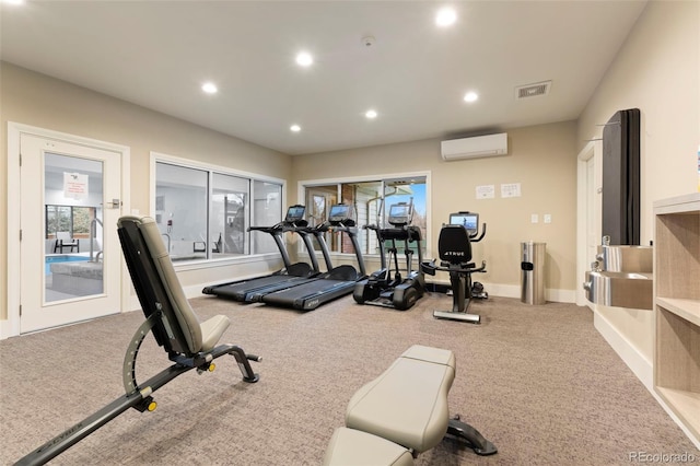 gym with recessed lighting, a wall mounted air conditioner, visible vents, and carpet