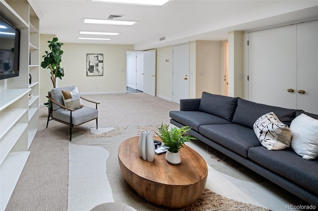 living area with carpet flooring and baseboards