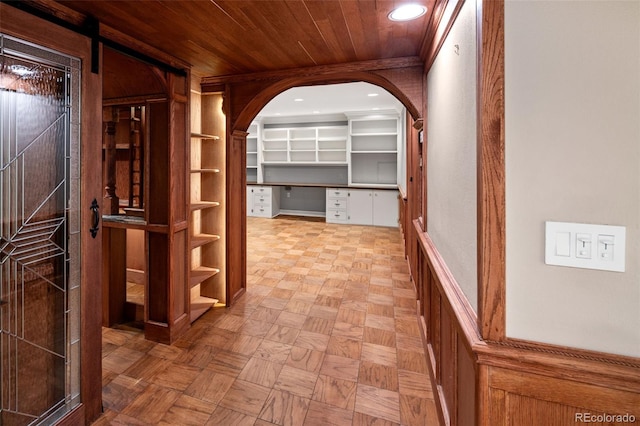 hall with arched walkways, recessed lighting, and wood ceiling