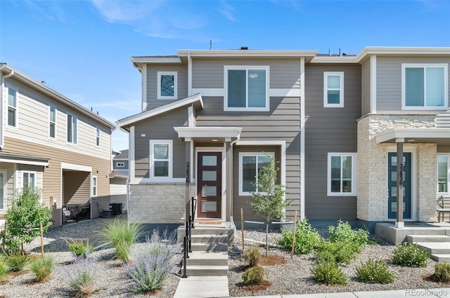 22826 E Tufts Pl Unit A, Aurora, CO 80015 - view of front of house featuring stone siding and entry steps