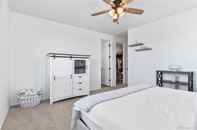 22826 E Tufts Pl Unit A, Aurora, CO 80015 - bedroom featuring carpet floors, a ceiling fan, and a spacious closet
