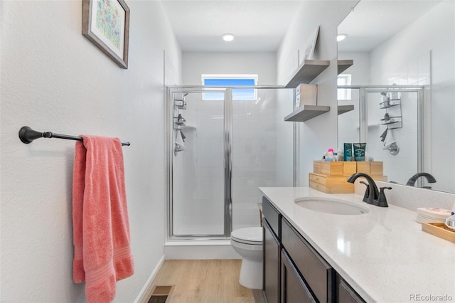 22826 E Tufts Pl Unit A, Aurora, CO 80015 - full bathroom featuring a stall shower, vanity, and wood finished floors
