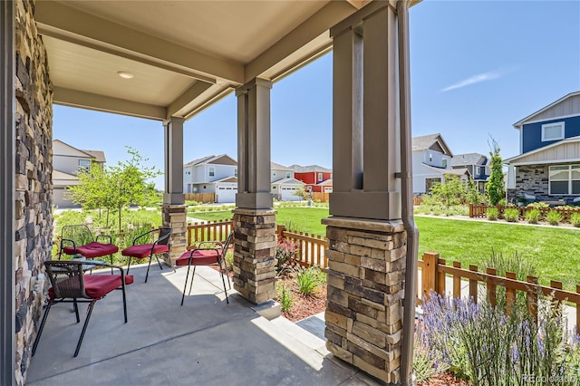 764 N Quatar St, Aurora, CO 80018 - porch featuring a residential view and a lawn