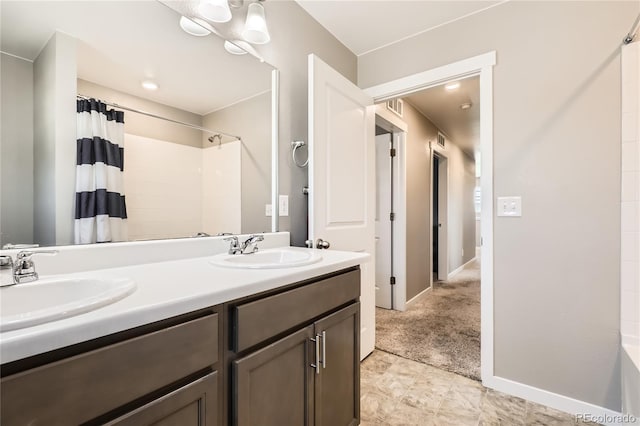 764 N Quatar St, Aurora, CO 80018 - bathroom featuring double vanity and baseboards