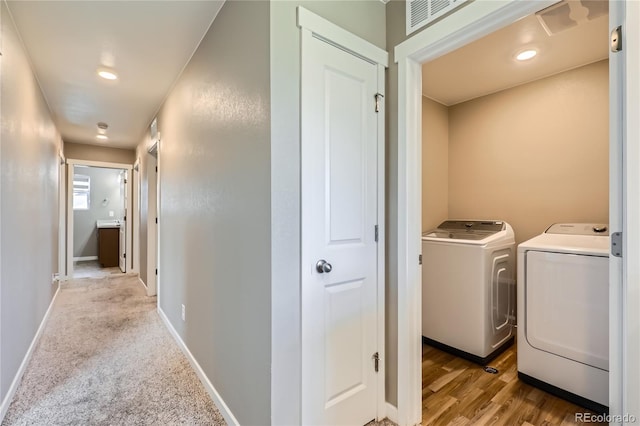764 N Quatar St, Aurora, CO 80018 - hallway with washer and clothes dryer and recessed lighting