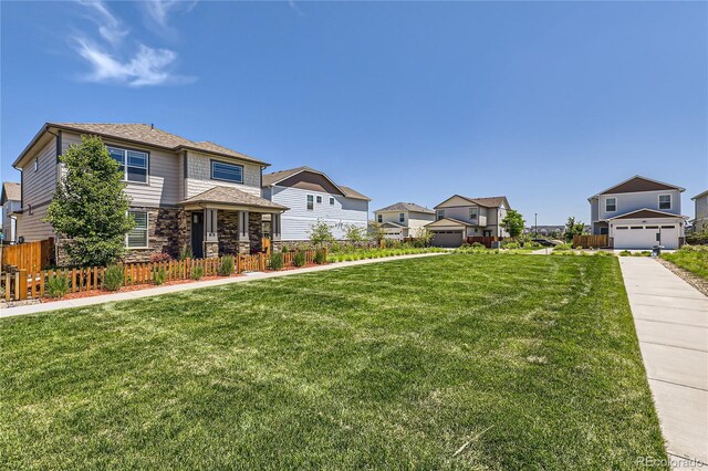 764 N Quatar St, Aurora, CO 80018 - view of front of house with a residential view and stone siding