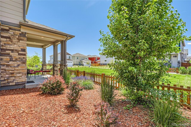 764 N Quatar St, Aurora, CO 80018 - view of yard with covered porch and a residential view