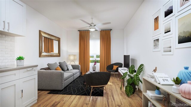 living room featuring light wood-type flooring and ceiling fan