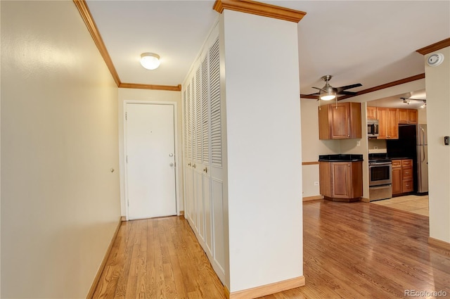 hall featuring ornamental molding and light wood-type flooring