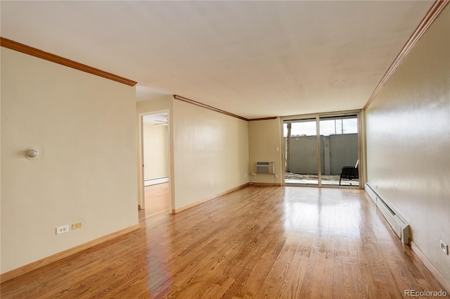 spare room with crown molding, a wall of windows, a baseboard heating unit, a wall unit AC, and light hardwood / wood-style floors