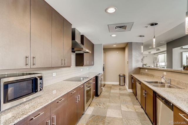 2001 Lincoln St Unit 2213, Denver, CO 80202 - kitchen with stainless steel appliances, a sink, wall chimney exhaust hood, baseboards, and light stone countertops