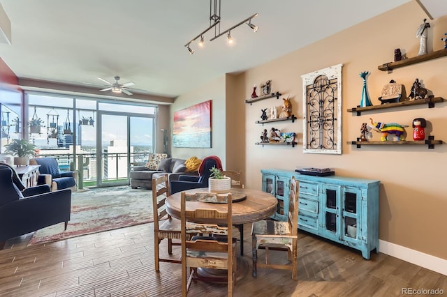 2001 Lincoln St Unit 2213, Denver, CO 80202 - dining space with a ceiling fan, wood finished floors, and baseboards