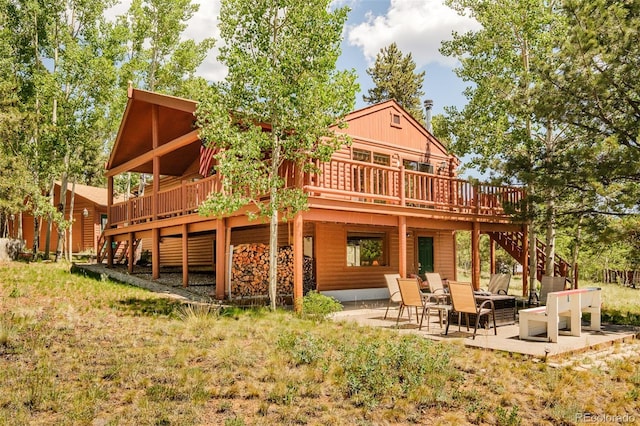 142 Summit Way, Bailey, CO 80421 - rear view of property with stairs, a deck, a patio, and faux log siding