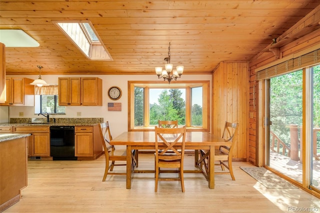 142 Summit Way, Bailey, CO 80421 - dining room featuring wood ceiling, a skylight, a chandelier, light wood-style flooring, and wooden walls