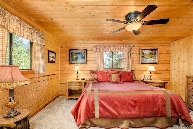 142 Summit Way, Bailey, CO 80421 - carpeted bedroom with wood ceiling, multiple windows, wooden walls, and a ceiling fan