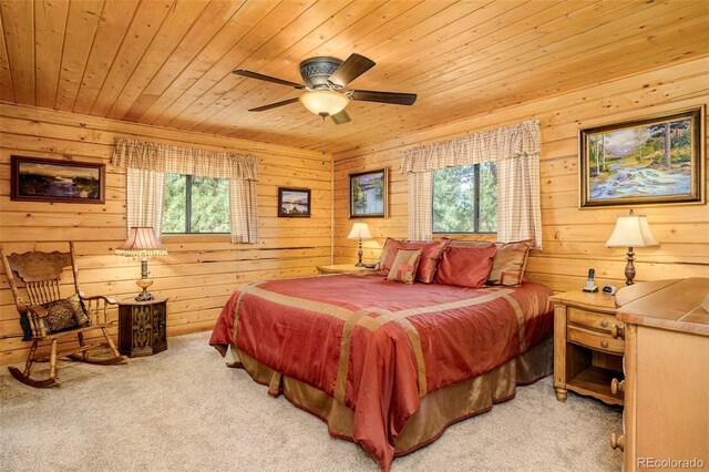 142 Summit Way, Bailey, CO 80421 - carpeted bedroom featuring wooden ceiling, multiple windows, wood walls, and ceiling fan