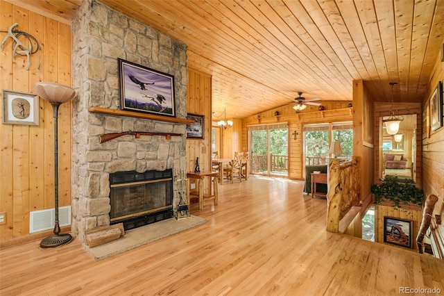142 Summit Way, Bailey, CO 80421 - living area with wooden walls, wood ceiling, wood finished floors, vaulted ceiling, and ceiling fan
