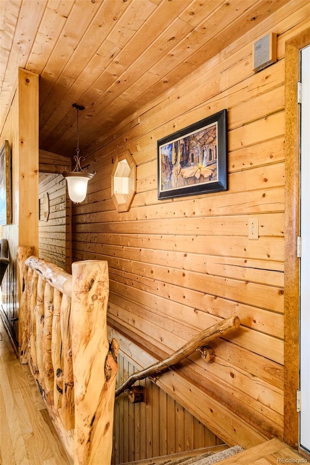 142 Summit Way, Bailey, CO 80421 - staircase with wood walls, wood ceiling, and wood finished floors
