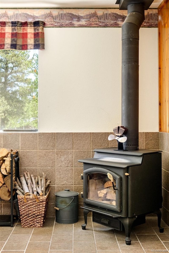 142 Summit Way, Bailey, CO 80421 - detailed view of a wood stove, tile walls, and wainscoting
