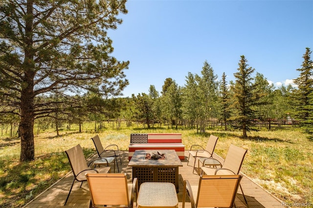 142 Summit Way, Bailey, CO 80421 - view of patio / terrace featuring a fire pit and outdoor dining space