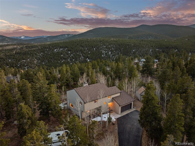 381 Highlands Dr, Bailey, CO 80421 - aerial view at dusk with a mountain view and a view of trees