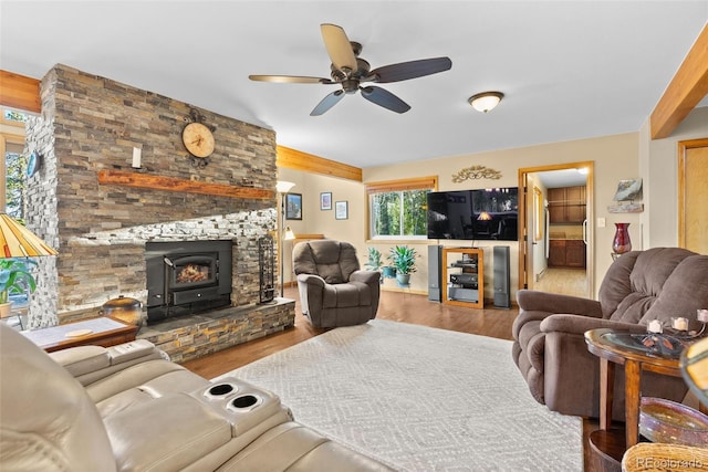 381 Highlands Dr, Bailey, CO 80421 - living area featuring a fireplace, ceiling fan, and wood finished floors