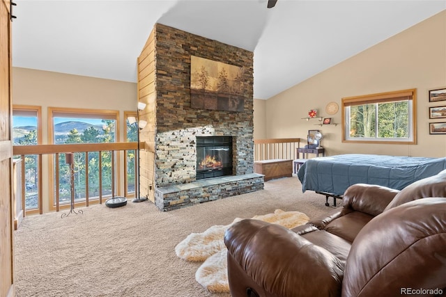 381 Highlands Dr, Bailey, CO 80421 - bedroom featuring a stone fireplace, carpet flooring, and high vaulted ceiling