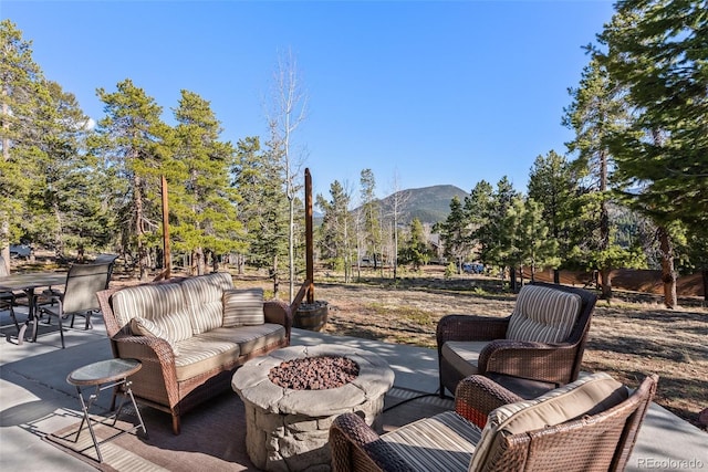 381 Highlands Dr, Bailey, CO 80421 - view of patio featuring an outdoor fire pit and a mountain view