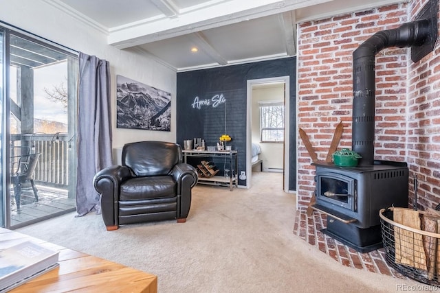 living area with carpet, coffered ceiling, beam ceiling, crown molding, and a wood stove