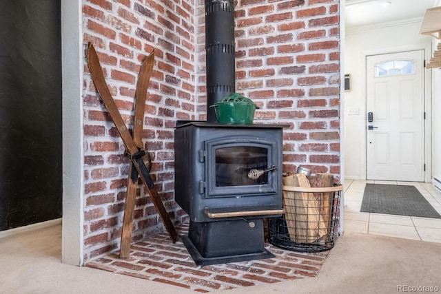 interior details with carpet flooring, a wood stove, and crown molding