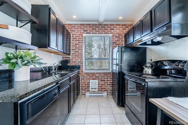 kitchen with black appliances, brick wall, dark stone countertops, and a sink