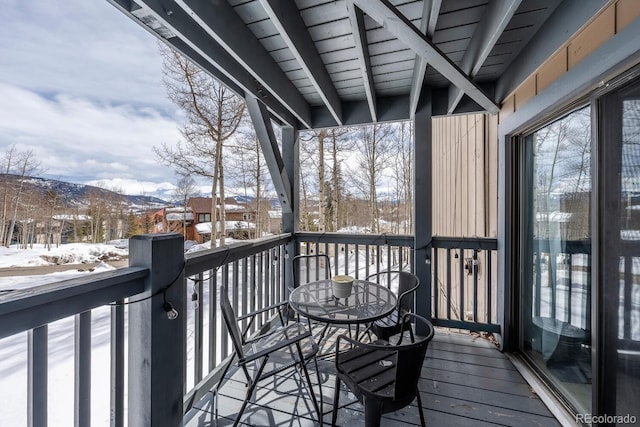 view of snow covered deck