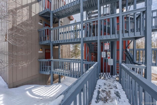 view of snow covered property entrance