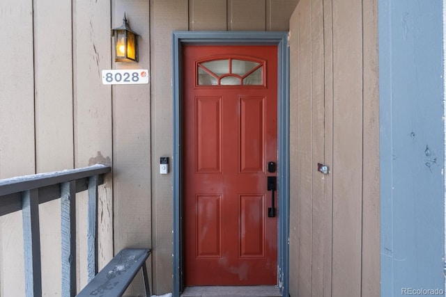 entrance to property featuring board and batten siding
